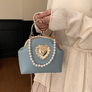 Blue lychee leather shell bag with baroque heart buckle and elegant pearl handle