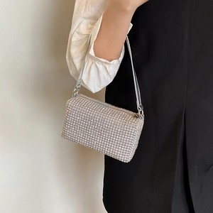 Elegant silver rhinestone crossbody pillow bag for women shown at a 45-degree angle