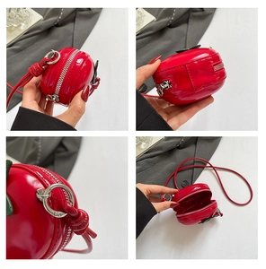 Détails du mini sac pomme rouge en cuir verni brillant avec fermeture éclair argentée