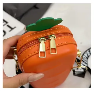 Close-up of carrot-shaped bag with premium orange faux leather and smooth golden dual zippers