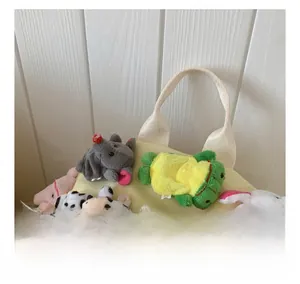 Detail showing soft canvas backpack handles with various cute plush animal charms attached