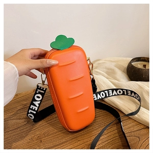 Detail of creative carrot-shaped crossbody bag with a wide LOVE shoulder strap