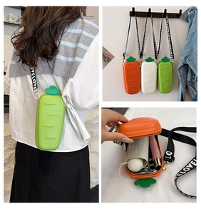 Detail view of carrot-shaped silicone crossbody bag showing interior capacity and strap