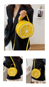 Detail of creative lemon slice shaped crossbody bag with realistic fruit texture