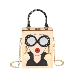 Artistic gold hard-shell crossbody bag with cartoon face and silk scarf handle