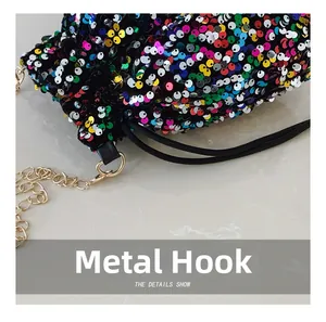 Detailed close-up of colorful sequins and premium gold-tone metal hardware on the bucket bag