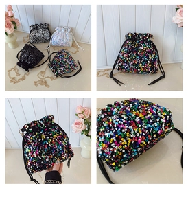 Detailed views of sequined bucket bags with chain straps and drawstring closure