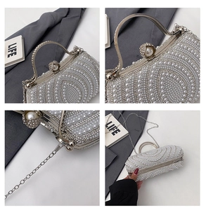 Macro detail of wave-patterned pearl evening clutch with rhinestone accents and chain