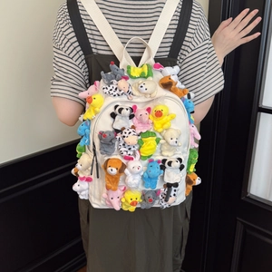 Cute off-white canvas backpack with colorful plush animal dolls for student school life