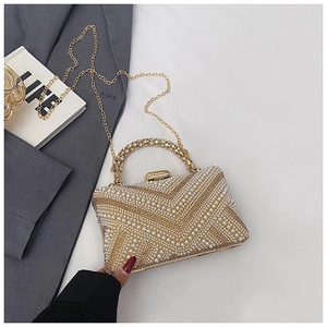 Detail of evening clutch with pearl and rhinestone V-pattern and gold metal handle