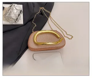 Rose gold glitter evening clutch with stylish metal handle and phone size comparison