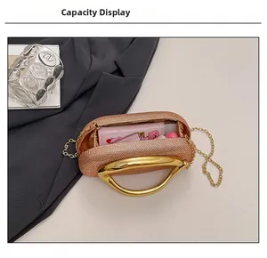 Detail showing internal capacity of the rose gold sequin evening bag with essentials
