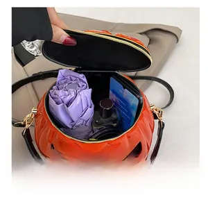 Interior view showing the capacity of this orange pumpkin bag with daily essentials