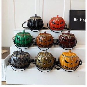 Detailed view of Halloween pumpkin crossbody bags in eight vibrant colors on a white display