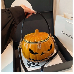 Detailed view of pumpkin-shaped handbag in premium gift box with glossy finish