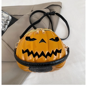 Close-up of Halloween pumpkin shoulder bag with glossy finish and crocodile strap