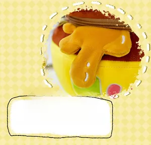 Detail of plush honey pot bag with zipper opening and cute yellow cartoon texture
