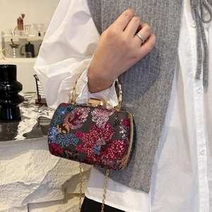 Embroidered sequin box clutch with floral patterns, bamboo handle and gold chain strap