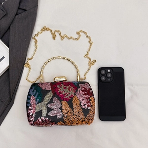 Elegant floral embroidered evening clutch with gold bamboo handle and sequin flower details