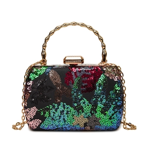 Luxury evening clutch with colorful sequins, gold bamboo handle, and rhinestones lock