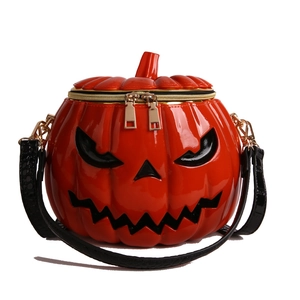 Halloween pumpkin crossbody bag in orange glossy leather with jack-o'-lantern face