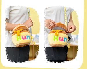 Detail of cute honey pot plush bag with Hun embroidery and yellow plastic chain strap