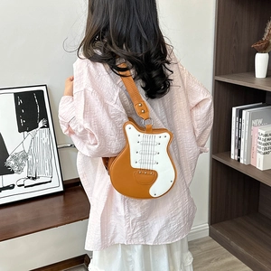 Creative guitar-shaped crossbody bag with wide canvas strap and brown white PU leather