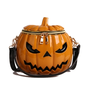 Quirky Jack-O'-Lantern pumpkin crossbody bag in orange glossy finish with golden zippers