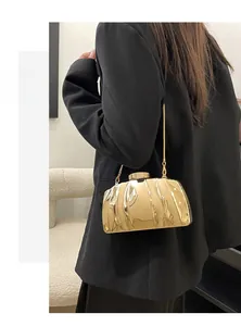 Chic gold metallic box clutch bag with shell-like pleated texture and chain strap