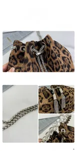 Close-up of leopard print bucket bag with rhinestone tassels and silver chain detail