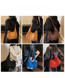 Detail showing various colors of fringe crossbody bags with boho tassel accents