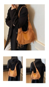Detail of adjustable metal buckle and long fringe tassels on brown suede hobo bag