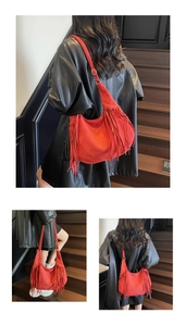 Detail of red suede hobo bag featuring long tassel fringes and woven edge craftsmanship