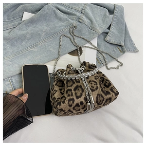 Detail of leopard print bucket bag with rhinestone trim and metallic tassel drawstring