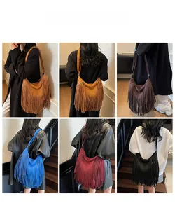 Detail of bohemian fringe shoulder bags in five colors showing suede texture and tassels