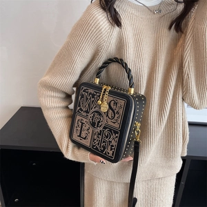 Retro black box crossbody bag with gold studs and top handle for women's fashion