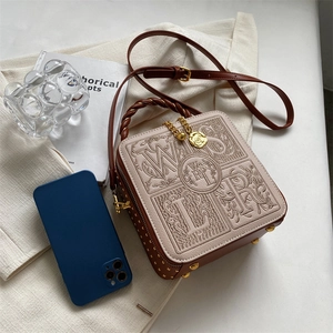 Vintage embroidered crossbody box bag with brown leather trim and metallic rivets