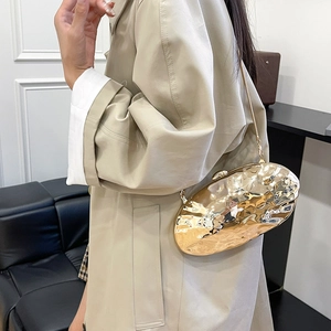 Chic gold bean-shaped evening bag with water ripple texture and fine chain strap