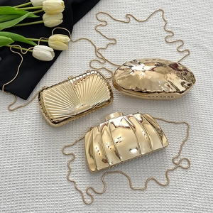 Golden metallic box clutches with diverse textures and elegant snake chains for evening