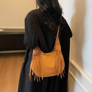 Vintage brown frosted suede hobo bag with long tassels and bohemian shoulder style