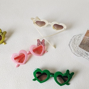 Kids heart shaped sunglasses with bow detail in assorted pastel colors for UV protection