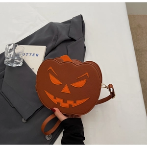 Detailed view of Jack-o'-lantern pumpkin bag with litchi grain PU texture and strap