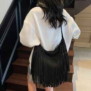Vintage large black fringe shoulder bag with bohemian tassel detail for stylish women