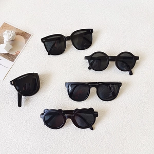 Collection of five vintage black kids sunglasses in various stylish retro frame designs