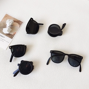 Retro black kids sunglasses set with round, square, and bear-ear frames on white background