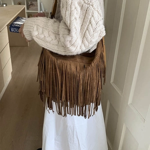 Brown suede tassel crossbody bag with bohemian fringe detail for autumn fashion