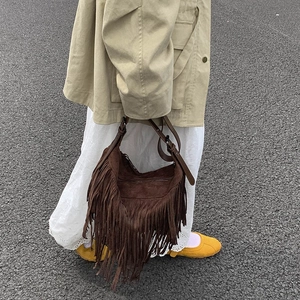 Deep brown matte suede tassel crossbody hobo bag with adjustable strap in vintage style