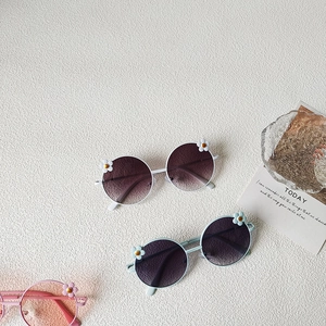 Retro flower frame kids sunglasses in white, light blue and pink with gradient lenses