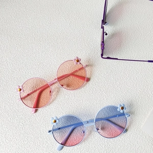 Fashionable flower frame round sunglasses for kids in pink and blue gradient lenses