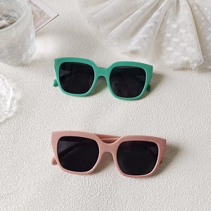 Minimalist square sunglasses for women in mint green and lotus pink with dark lenses